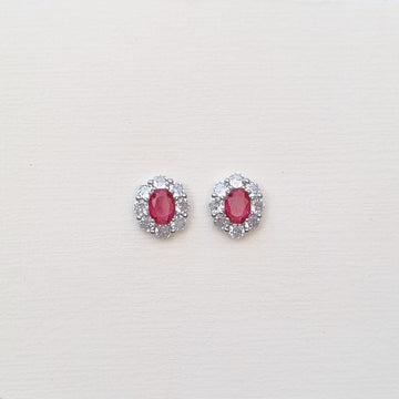 OVAL RUBY HALO STUDS E182